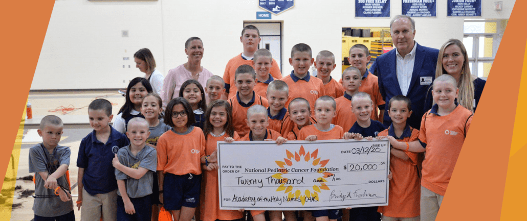 A group of kids and adults are holding a large check for $20,000 made out to the National Pediatric Cancer Foundation.