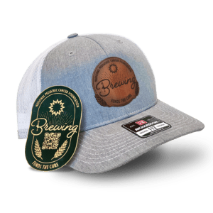 A hat and a tag promoting the National Pediatric Cancer Foundation, with "Brewing Funds the Cure" featured.